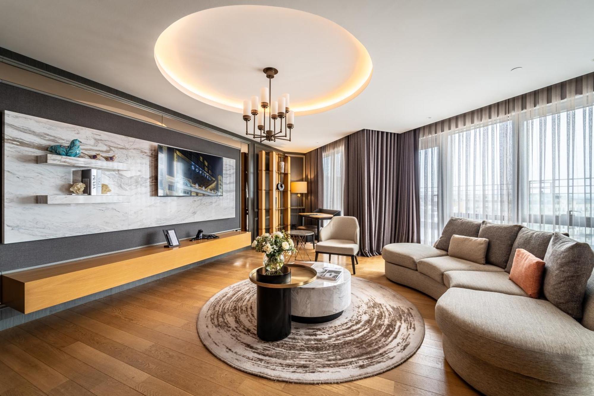 Sofitel Istanbul Taksim Hotel Exterior foto A living room in a luxury apartment